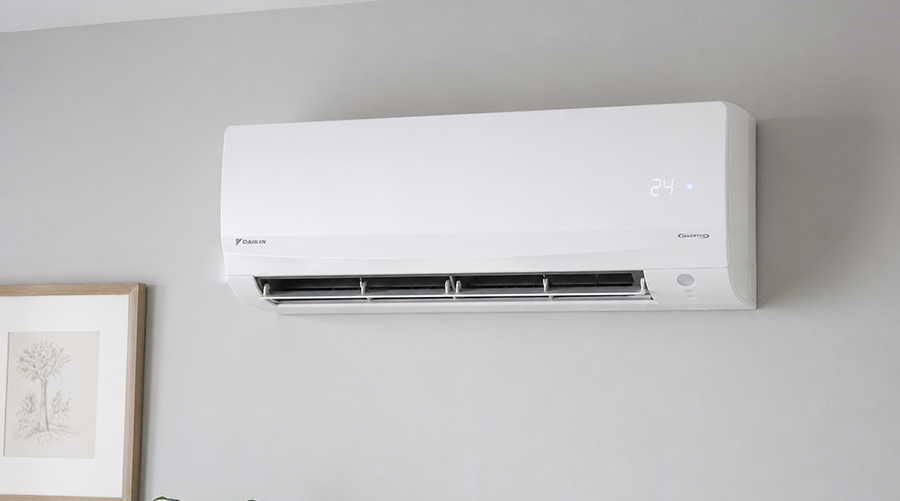 Modern wall-mounted AC unit installed in clean home interior