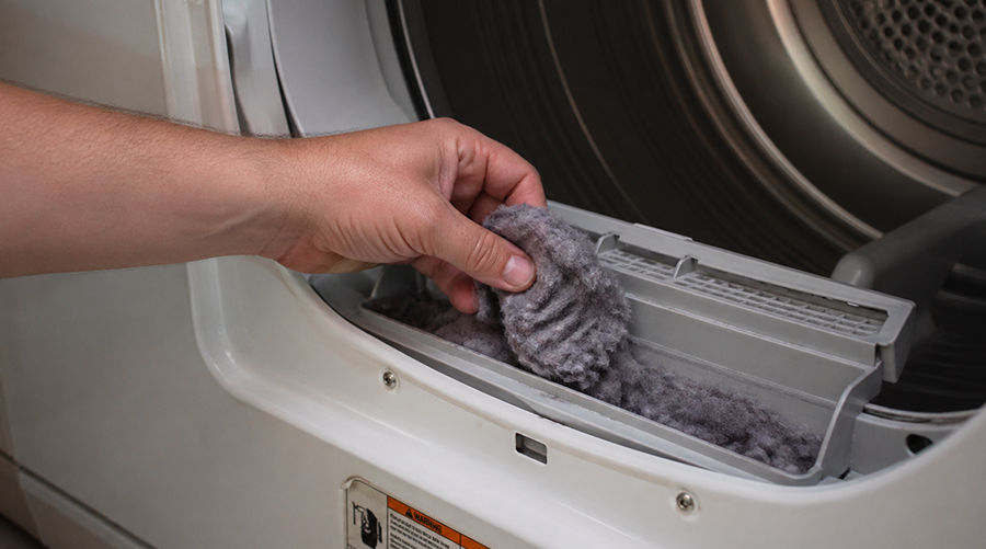 Dryer lint removal from filter inside home dryer machine